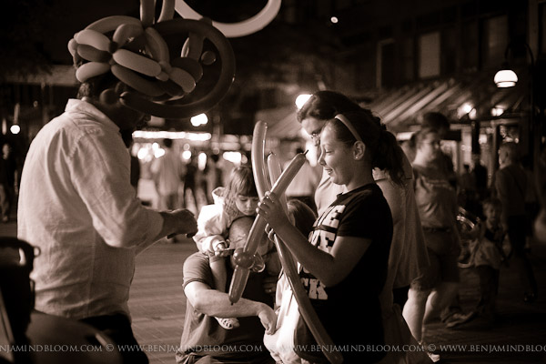 Dux The Balloon Man twisting his creations on Church St at the Burlington Discover Jazz Festival