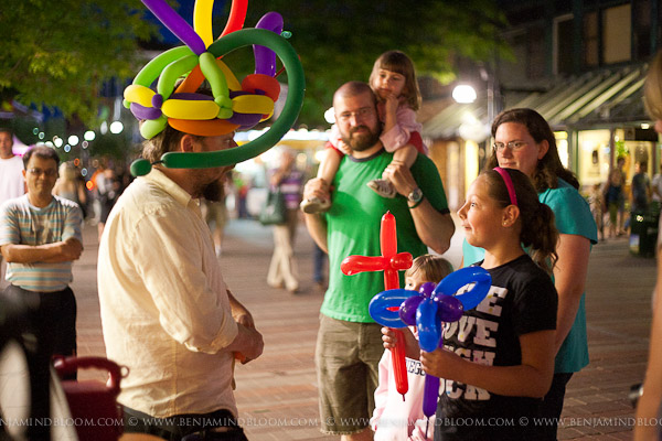 Dux The Balloon Man twisting his creations on Church St at the Burlington Discover Jazz Festival