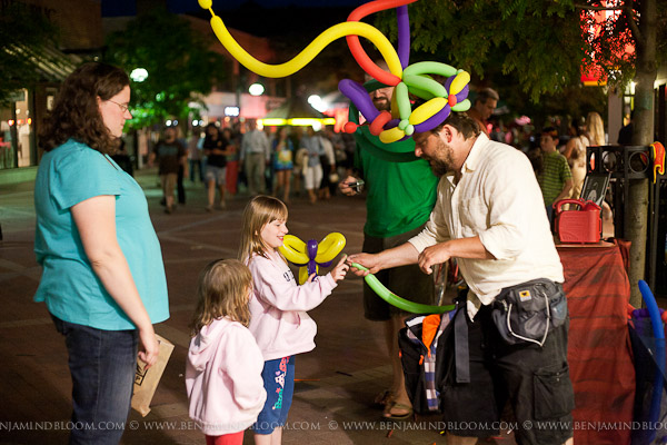 Dux The Balloon Man twisting his creations on Church St at the Burlington Discover Jazz Festival